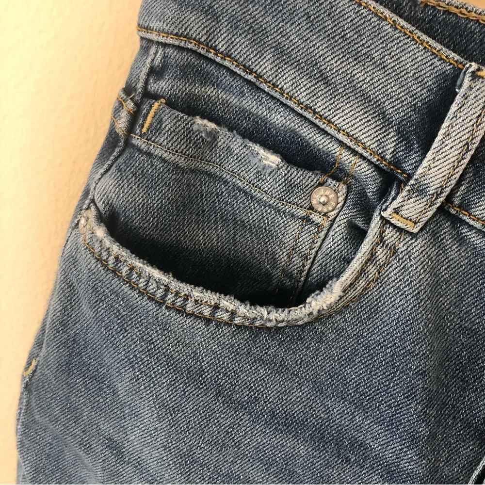 Free people we the free phoenix distressed blown out knees high rise jeans